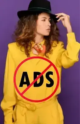 woman in a yellow dress wearing a black hat and no ads icon